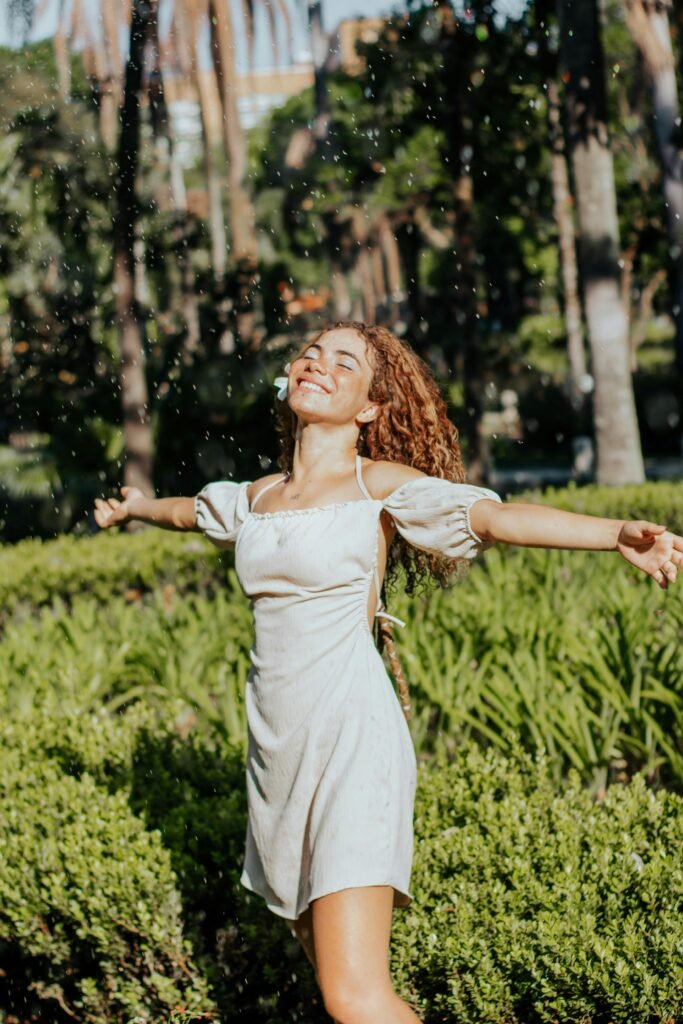 Confident woman enjoying nature, embracing the childfree lifestyle with freedom and joy