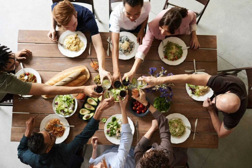 Group of friends making a toast, symbolizing chosen family and community — Childfree is the Future How a Growing Trend is Redefining Society.