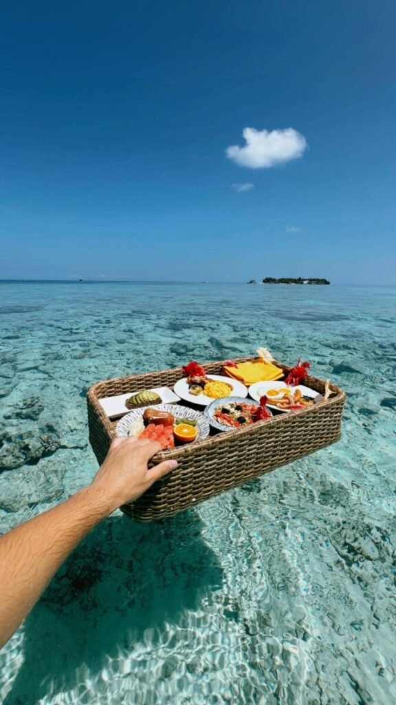 A luxurious floating breakfast for one at a Maldives resort, representing high-end solo childfree travel and the SINK lifestyle.