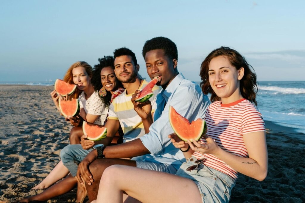 Chosen family childfree friends enjoying beach time and building strong community connections.