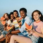 Chosen family childfree friends enjoying beach time and building strong community connections.