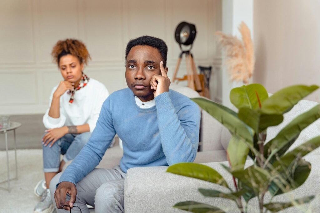 Couple looking stressed while thinking about reasons you shouldn't have children.