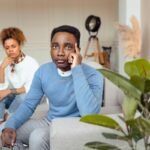 Couple looking stressed while thinking about reasons you shouldn't have children.